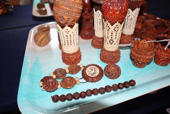 A group of 19th century coquilla nut and vegetable ivory engine turned containers, stands, miniature baskets, napkin rings and jeweller